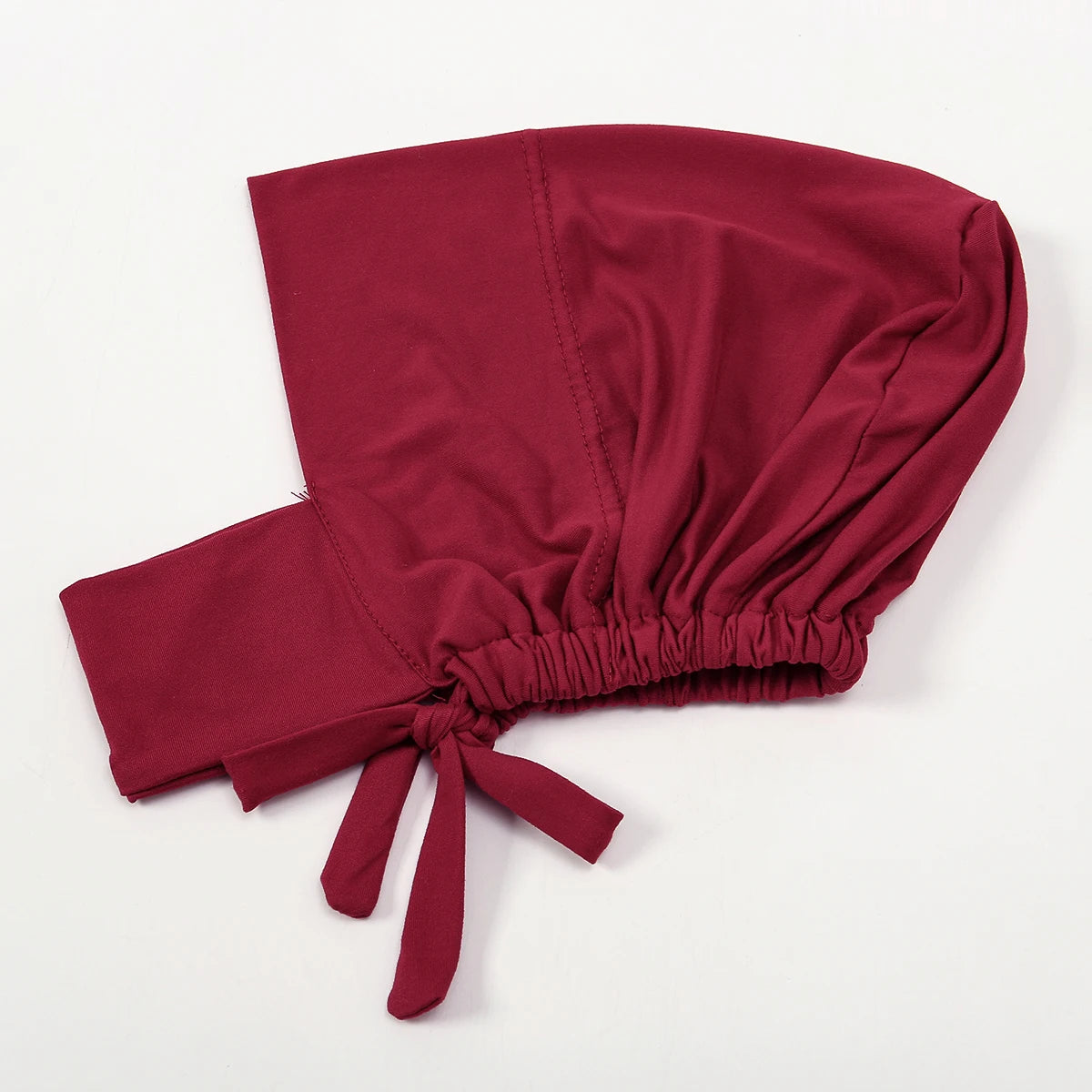 A deep maroon elegant cotton polyester inner hijab cap scarf tied at the bottom.