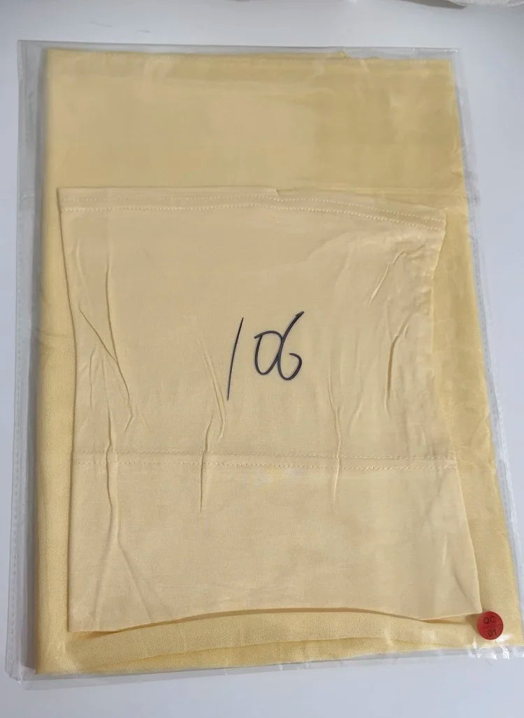 A light yellow soft modal rayon hijab set packaged in plastic.