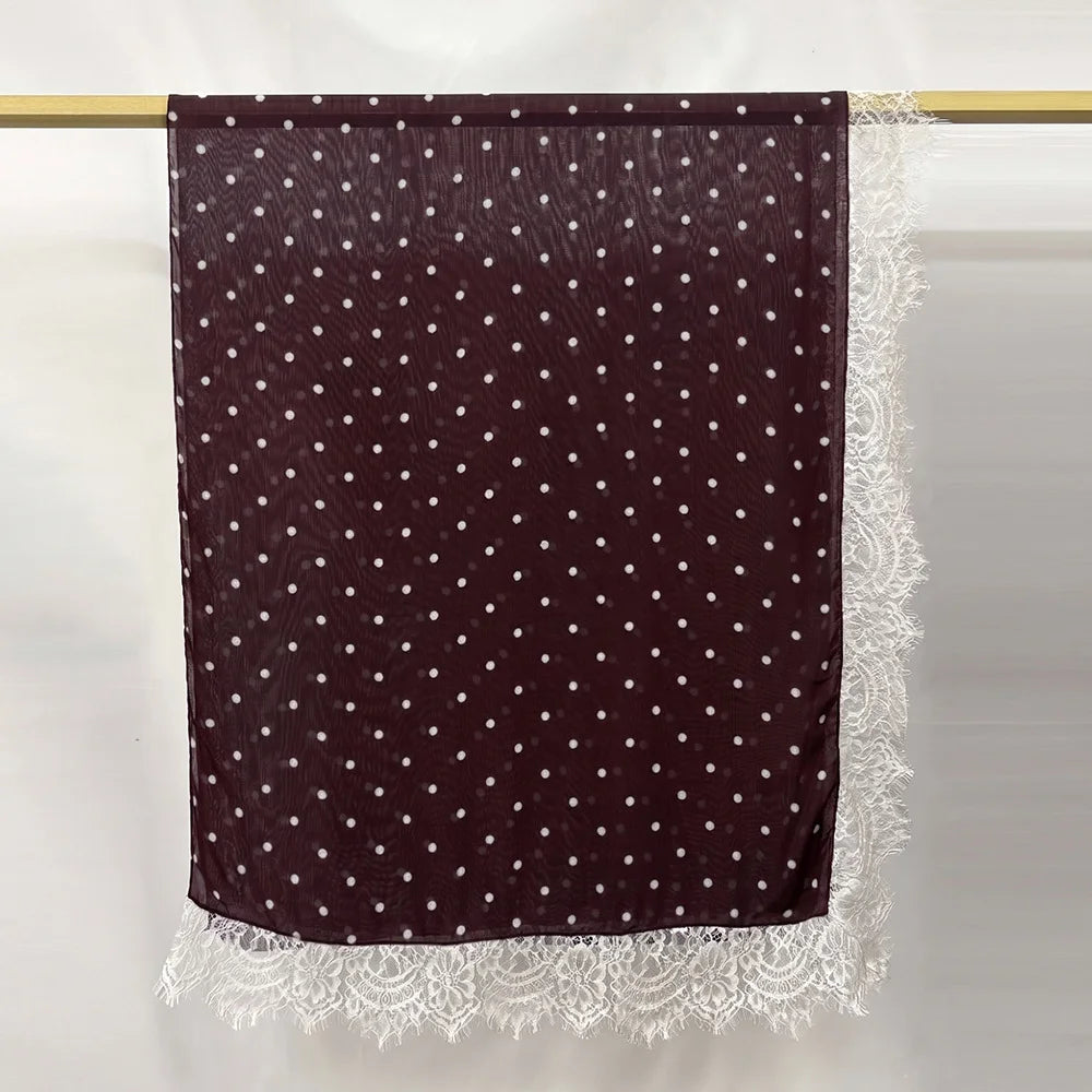Hijab color maroon, made of lace modal fabric with white polka dots and a white lace trim.