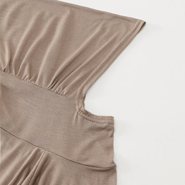 A close-up of a beige ready-to-wear cotton blend hijab cap showing the fabric texture and seam detail.