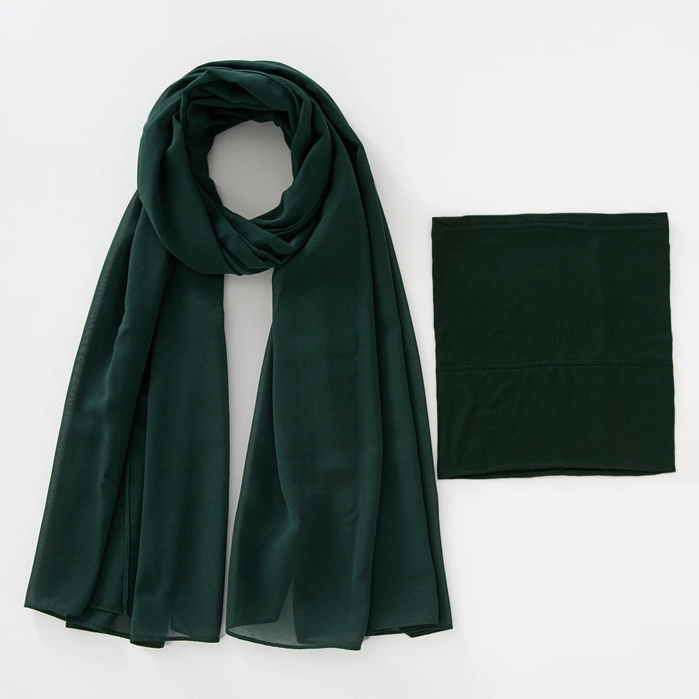 A dark emerald green chiffon hijab and underscarf set displayed flat.