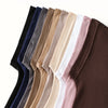 Eine Reihe von Instant-Turban-Hijab-Untercaps in verschiedenen einfarbigen Farben, darunter schwarz, marineblau, grau, beige 