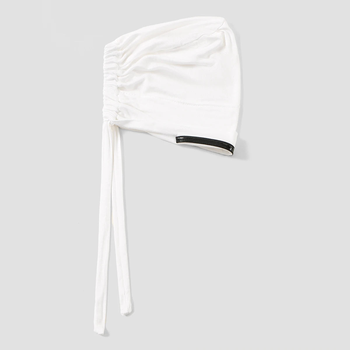 White elegant anti-slip inner hijab cap with a gathered fabric top and a black trim detail.