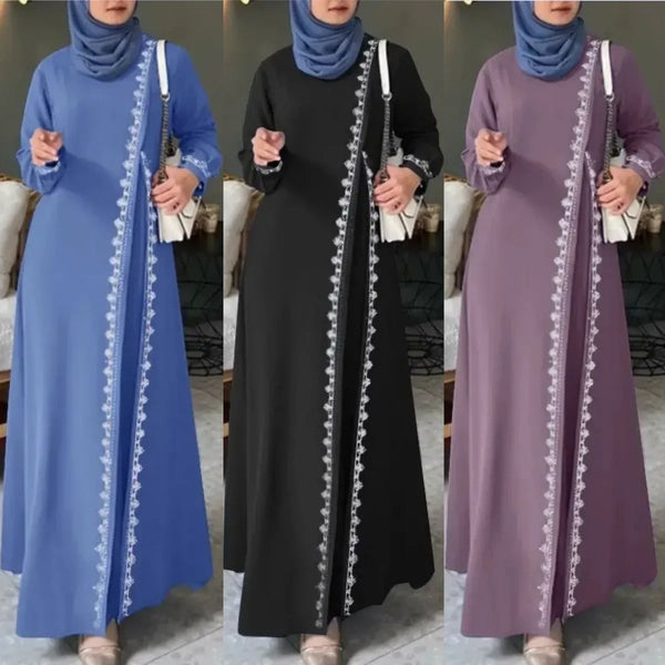 A woman wearing an elegant lace abaya dress in blue, black, and purple tones.