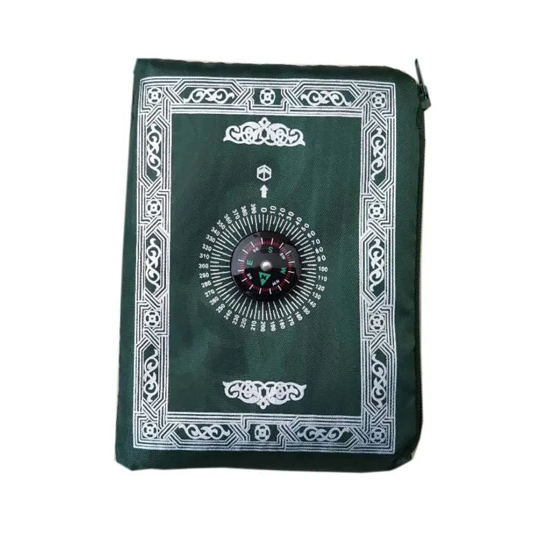 A dark green portable braided prayer rug featuring an ornate compass design.