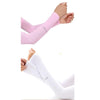 A pair of white cooling UV protection arm sleeves shown on a hand and forearm.