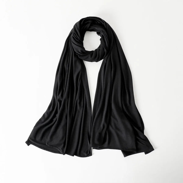A black chiffon shawl draped in a loop, shown against a white background.