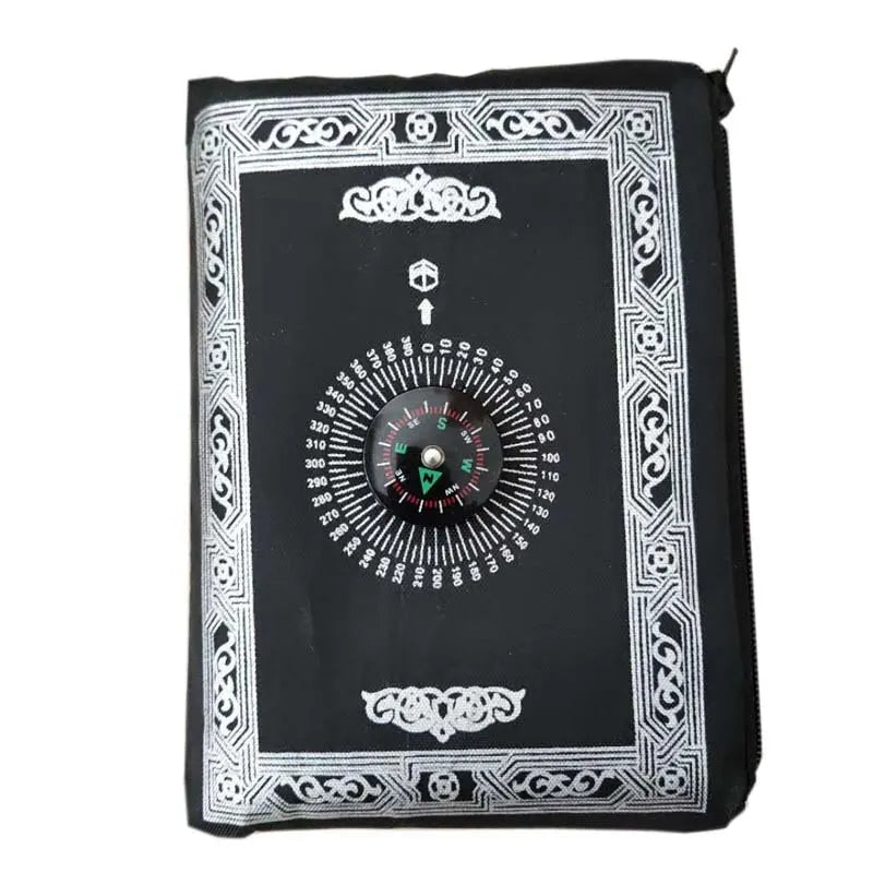 Black portable braided prayer rug featuring a compass and prayer markings.