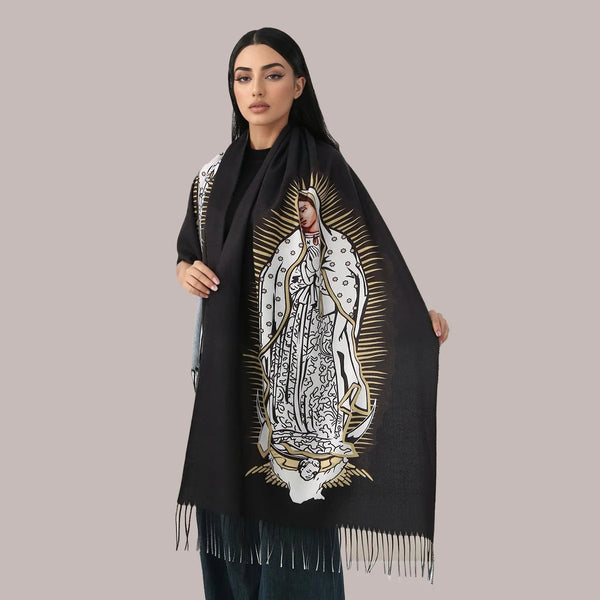 A woman models an elegant black scarf featuring a portrait of the Virgin Mary in white and gold embroidery.