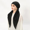 A model wearing a black solid linen elastic headscarf cap and white top.