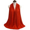 A vibrant orange premium modal jersey hijab draped around a mannequin's neck.