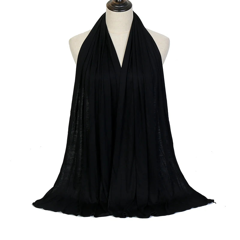 Black soft modal jersey hijab scarf draped around a mannequin's neck