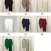 A collection of eight elegant two-piece abaya and khimar sets displayed on gold hangers against a white background.