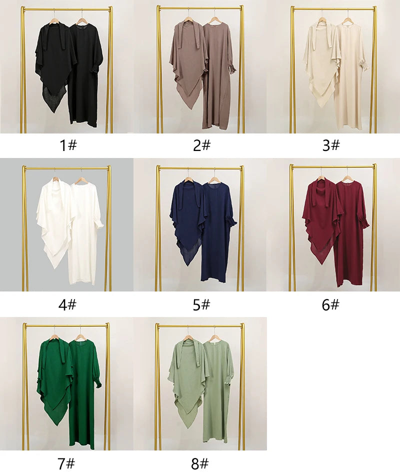 A collection of eight elegant two-piece abaya and khimar sets displayed on gold hangers against a white background.