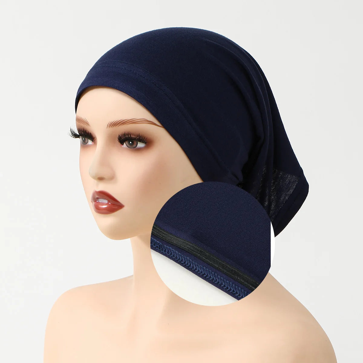 A woman wearing a navy blue elegant anti-slip inner hijab cap.