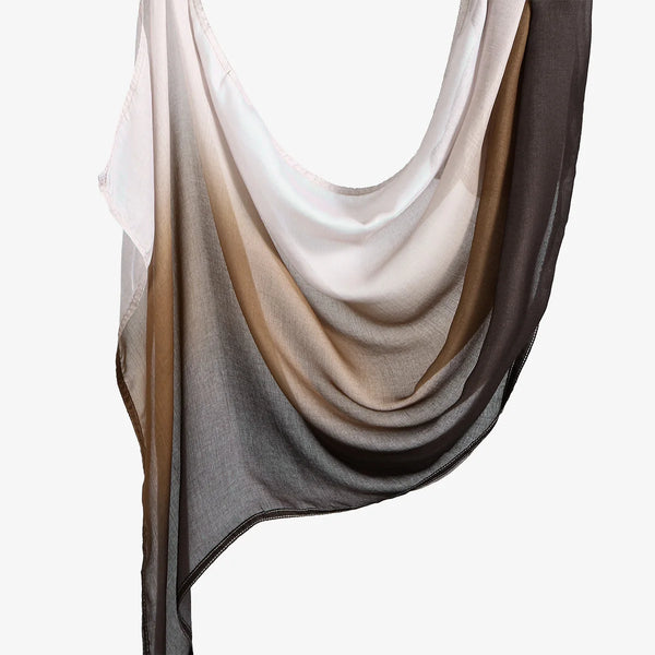 A flowing, sheer cotton modal hijab scarf in shades of beige, taupe, and charcoal gray.