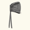 A gray adjustable elastic headband hijab cap for women shown flat lay.