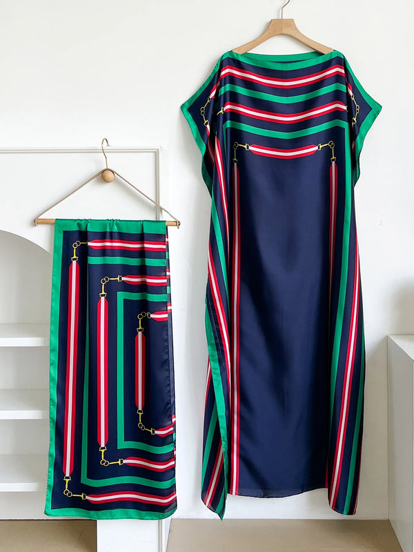 A navy blue silk kaftan dress featuring vertical stripes in red, white, and green.