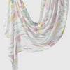Elegant printed linen hijab scarf featuring a watercolor floral pattern in pink, yellow, and green on a white background.