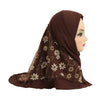 Brauner, durchscheinender Hijab mit kleiner weißer floraler Stickerei auf einem Mannequin-Kopf.