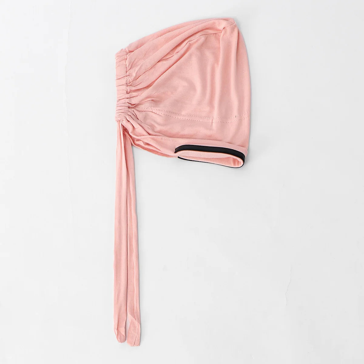 Turban hijab cap instant stretch rose pink with gathered fabric and black trim.