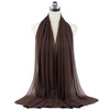 A dark brown chiffon hijab scarf draped around a mannequin's neck.