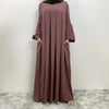 Langes mauve islamisches Kleid für Damen mit langen Ärmeln und drapiertem Schnitt.