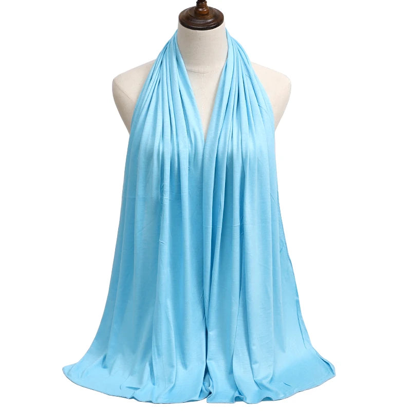 A light blue premium modal jersey hijab draped around a mannequin's neck.