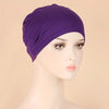 A purple classic stretch jersey turban cap displayed on a mannequin head.