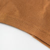 Close-up of a brown chiffon fabric with visible stitching on a garment edge.