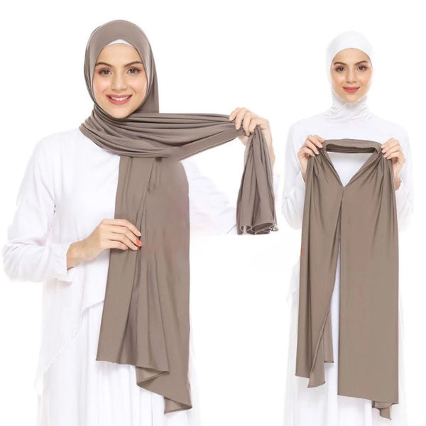 A woman models a beige stretchy jersey instant hijab scarf draped over her head and shoulders.