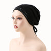 A black adjustable elastic headband hijab cap worn on a mannequin head.