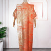 A woman wearing an orange satin kaftan abaya with gold embroidery displayed on a mannequin.
