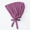 Weiches mauvefarbenes inneres Hijab-Bonnet mit gefaltetem Stoff.