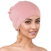 A woman wearing a pink breathable cotton underscarf with an elastic fit