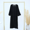 Black elegant women's abaya trench coat displayed on a gold hanger against a white background.