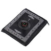 Black portable braided prayer rug featuring an ornate compass design.