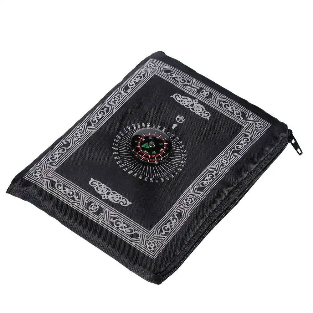Black portable braided prayer rug featuring an ornate compass design.
