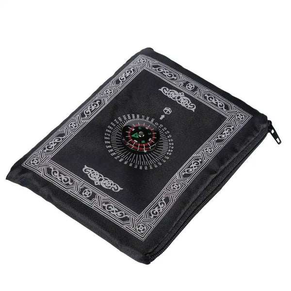 Black portable braided prayer rug featuring an ornate compass design.