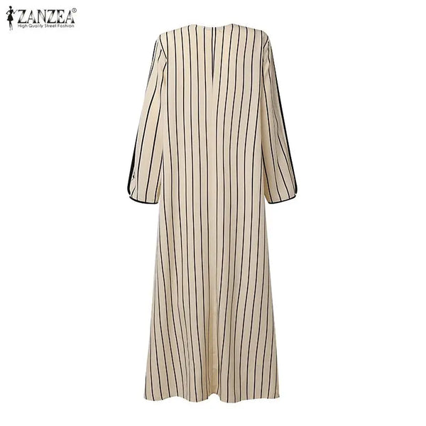A beige and black vertically striped maxi dress shown from the back.