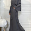 A full-length, charcoal gray elegant women's abaya and kaftan set worn by a model.
