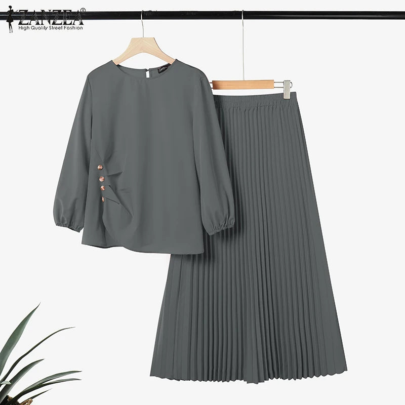 Ensemble haut à manches longues et jupe plissée grise pour tenue musulmane.