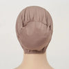 A close-up of a beige breathable cotton underscarf with an elastic fit, displayed on a mannequin's neck.