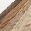 Primer plano de múltiples capas de pañuelos (hiyabs) de algodón rayón liso en tonos tierra como beige, caqui y marrón.