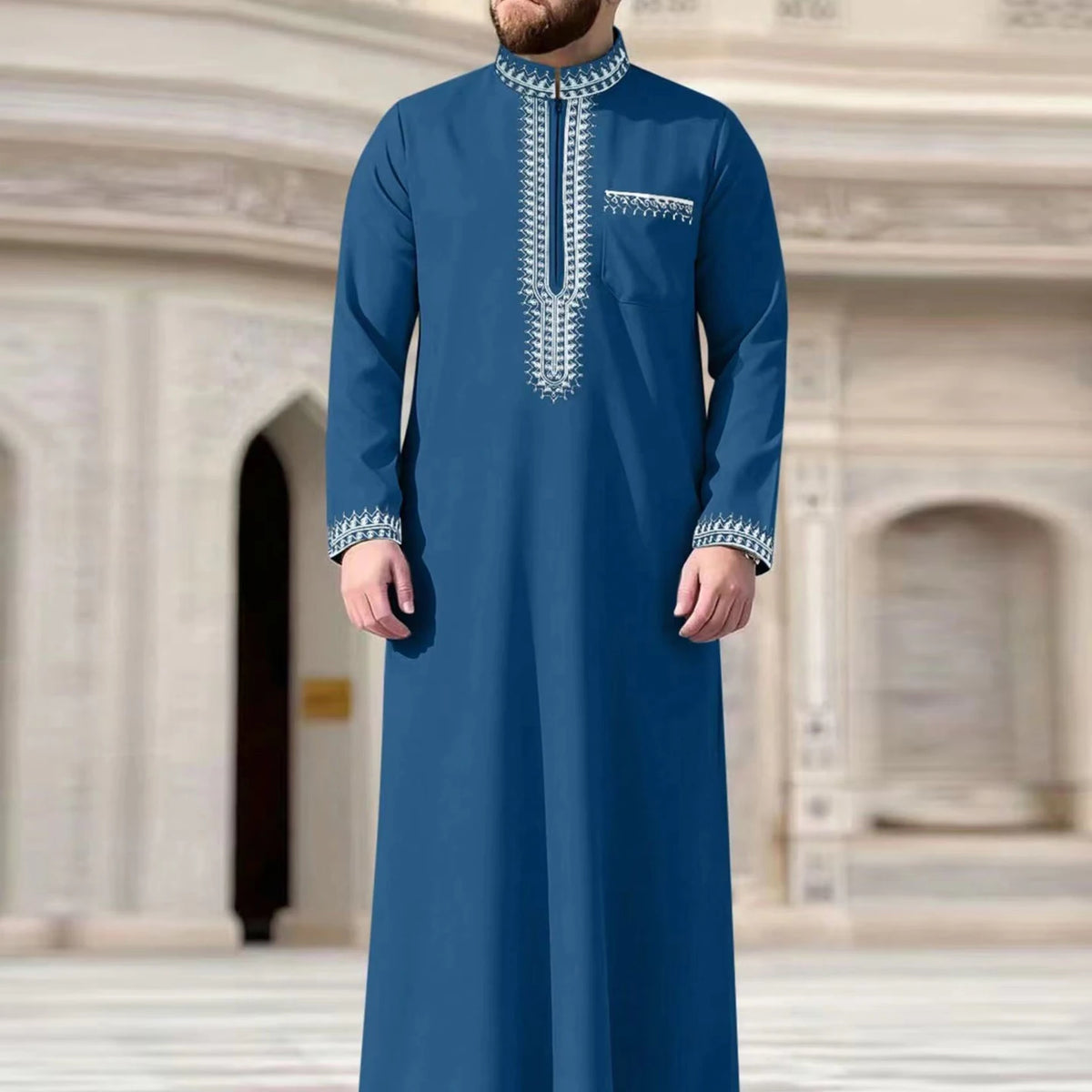 A deep blue Moroccan embroidered men's thobe jellaba with white stitching details.