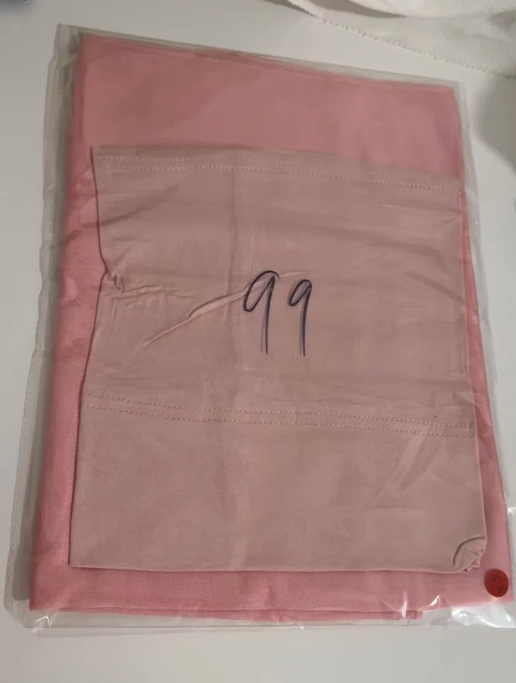 A pink soft modal rayon hijab set packaged in clear plastic.