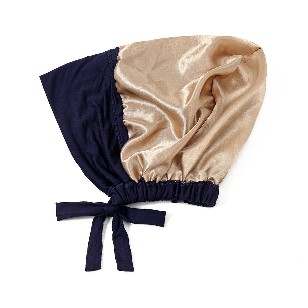 Elegant satin hijab cap and undercap set in navy blue and champagne gold.