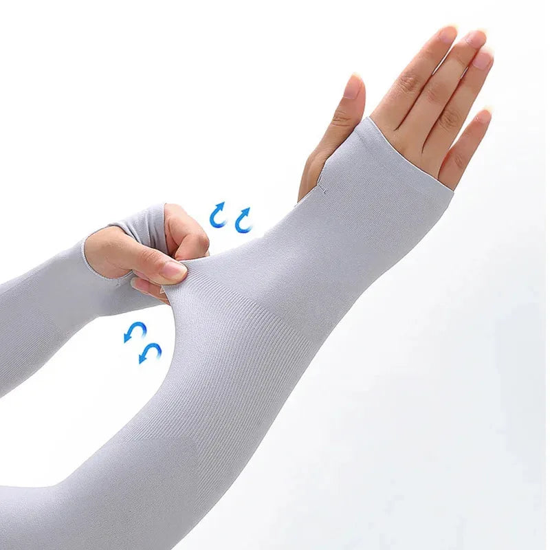 A hand wearing a light gray cooling UV protection arm sleeve, demonstrating the compression and fit.
