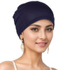 A woman wearing a navy blue breathable cotton underscarf with an elastic fit.