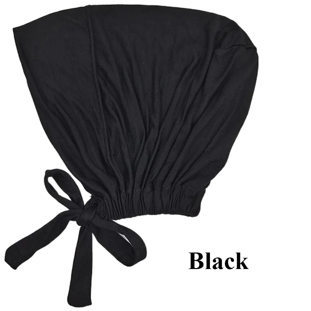 Pañuelo elegante negro tipo turbante sujeto con una cinta de tela